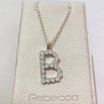B Initial Bling Pendant Silver/Clear by Rebecca - Available at SHOPKURY.COM. Free Shipping on orders over $200. Trusted jewelers since 1965, from San Juan, Puerto Rico.